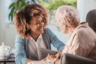 Caregiver providing companionship and supportive care to a senior in a warm, caring environment, ensuring emotional well-being.Caregiver providing companionship and supportive care to a senior in a warm, caring environment, ensuring emotional well-being. {{brizy_dc_image_alt imageSrc=